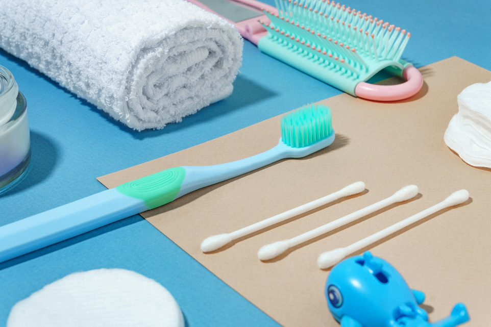 a blue toothbrush, toothpaste, toothpaste, and other items